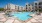 aerial of swimming pool with modern tile-work and ample seating